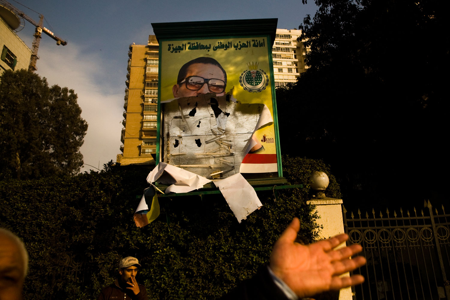 A torn poster of Egyptian President Hosni Mubarak.