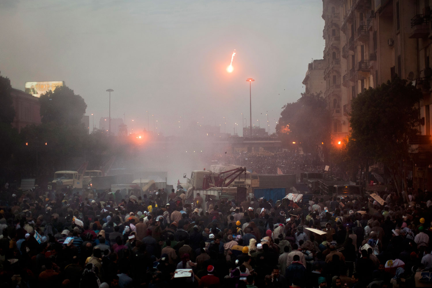 A molotov cocktail sails towards protestors in Tahrir Square.