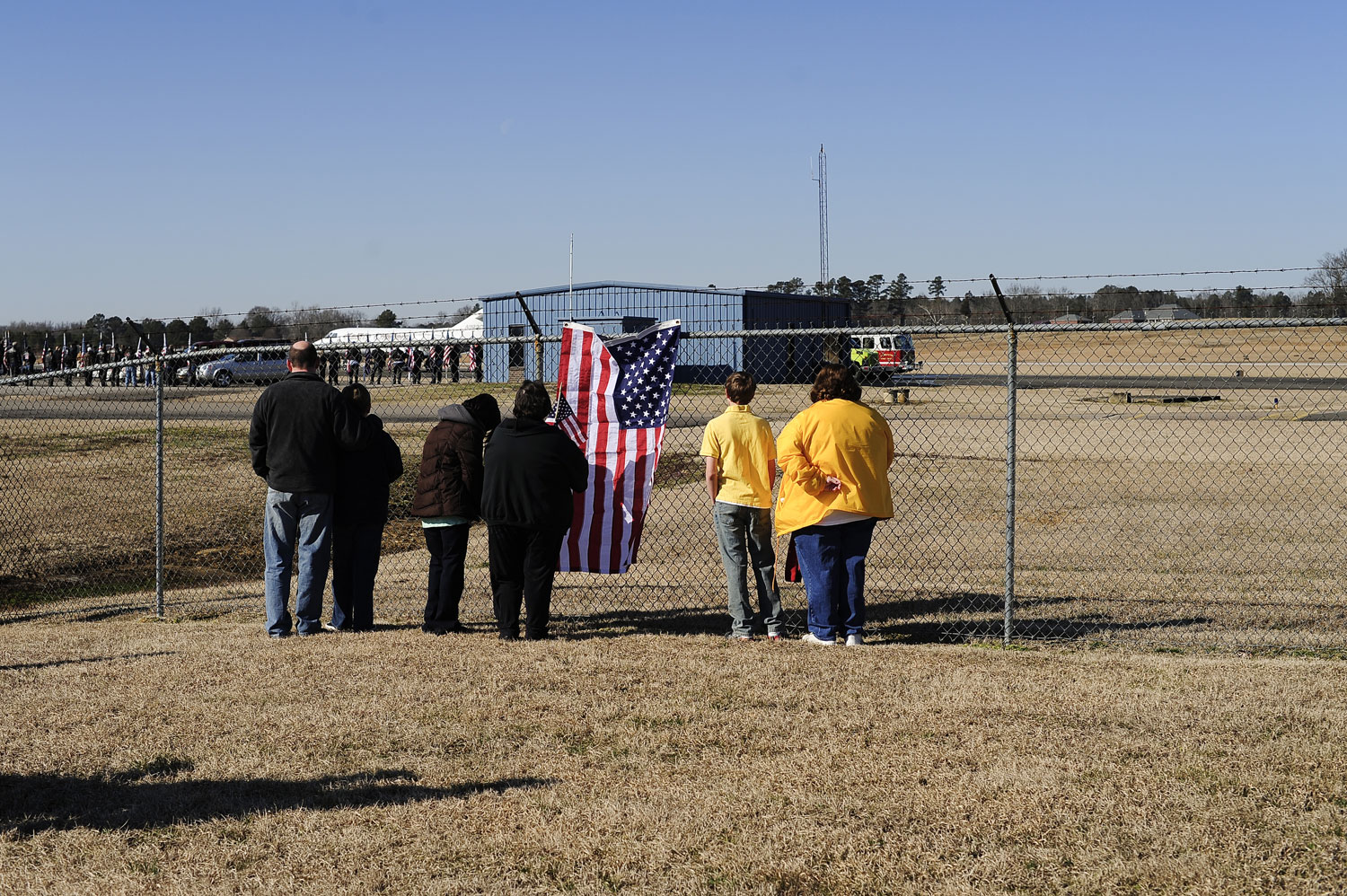 Mournful Welcome
                              Members of the community gather at the airfield in Corinth, Miss., as Ricketts' remains arrive.