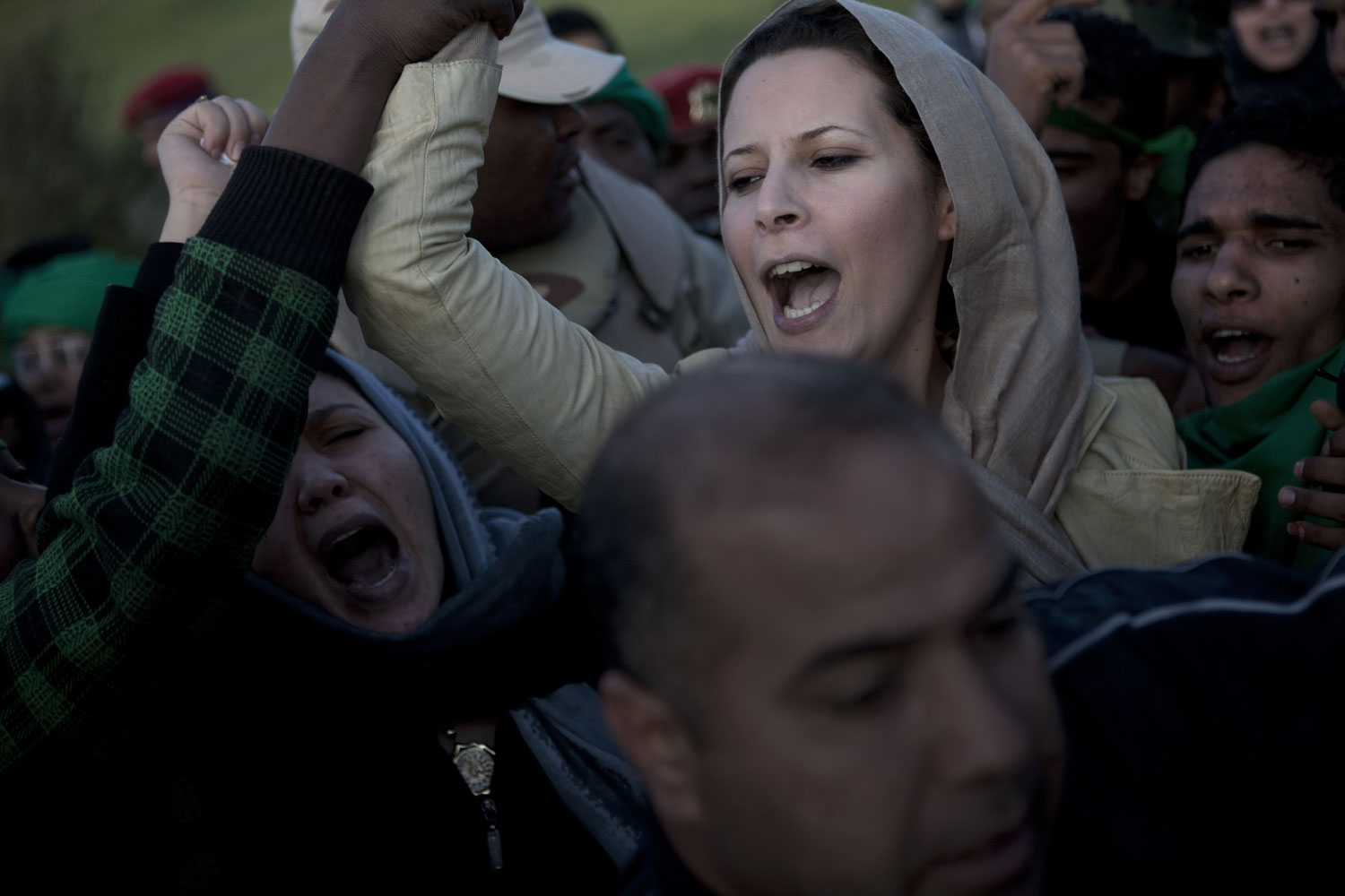 Ayesha Gaddafi, daughter of Muammar Gaddafi, with loyalist supporters in Tripoli