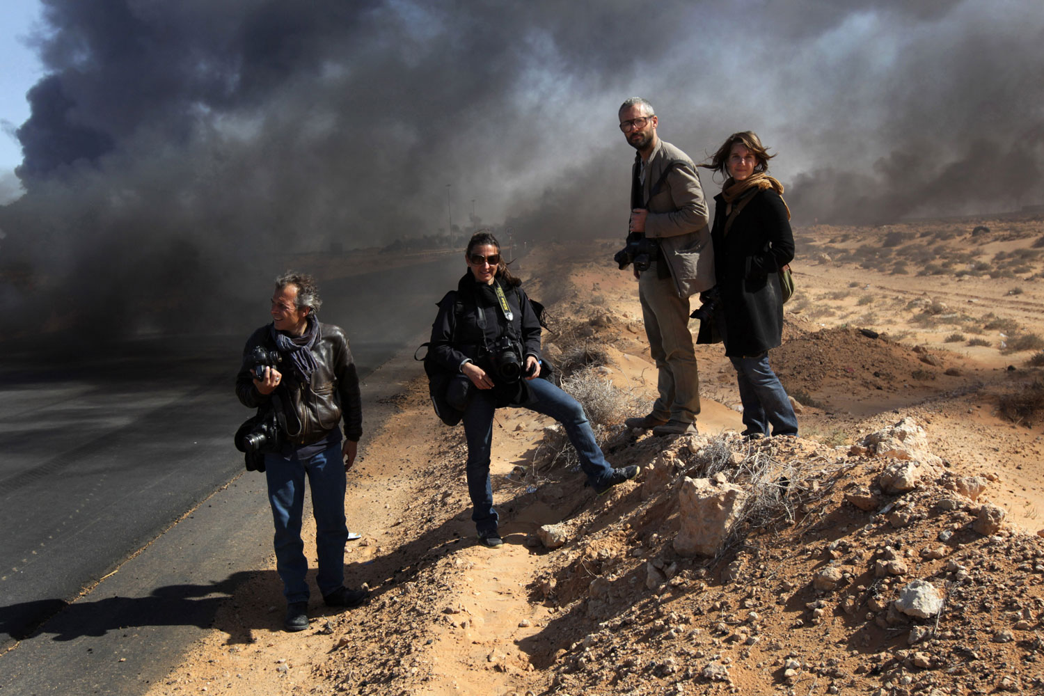 Yuri Kozyrev, Lynsey Addario, Tyler Hicks and Nicki Sobecki in Ras Lanuf, Libya, March 11, 2011.