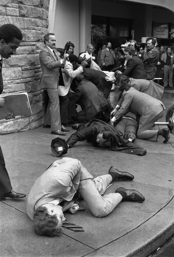McCarthy, officer Tom Delehanty and Brady all lay on the ground after being shot, as agents overwhelmed Hinckley. Of this other prize-winning frame, Edmonds recalled:  To me, [this] is one of the best pictures I made of the event, not having the President in it, that really kind of told the story. The reason that I got this picture is I was able to go around two [secret service] agents I had worked with and [they] kind of left me alone. I was able to stay out there for a little while until they pushed me out. It's not always clicking the shutter if you can't get there to click the shutter.