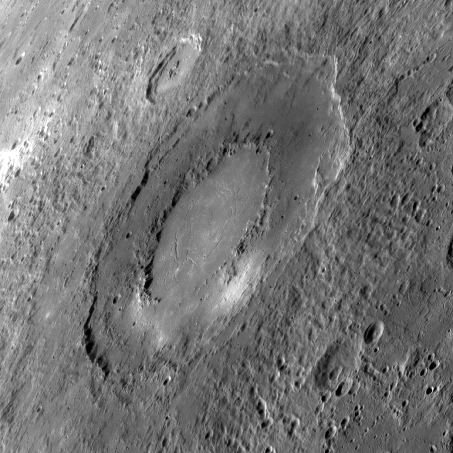 During a pre-orbital flyby in 2009, Messenger took this image of an as-yet unnamed impact basin. The outer diameter of the formation measures approximately 160 mi. (260 km).  One of the perks that comes with discovering or mapping a feature for the first time is the privilege of choosing its name. So far, no announcement about what the basin will be called.
