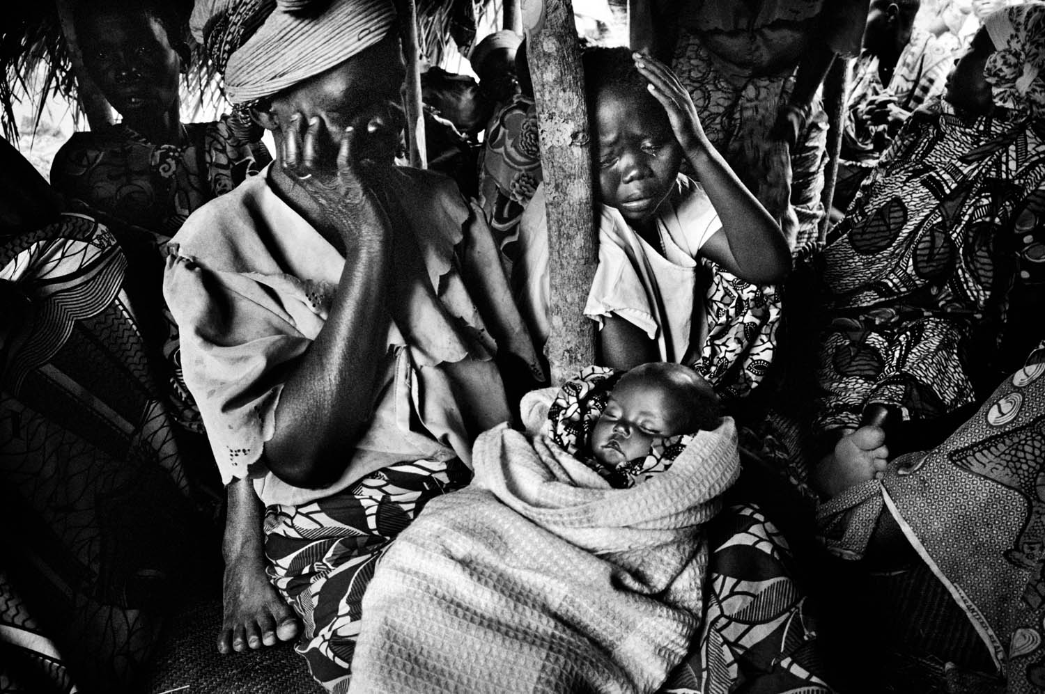 The funeral of Henry Konerala, 10-months-old, who died from diarrhea and vomiting a few days after arriving in the Gety camp, 2006. He was one of eighteen people who died that day, just before Congo's historic elections.