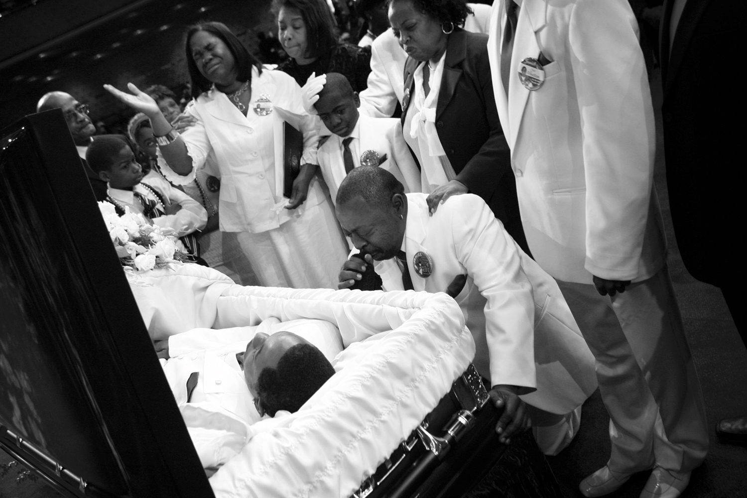 Jamiel Shaw Sr. kneels before his son's coffin during funeral services.  To see my son lying there dead in a casket to be shot, slaughtered  like a dog it makes you want to go out there and just round up everybody that's in a gang and makes you want to be a crime fighter.   On the same day as Jas' funeral, 19-year-old Pedro Espinoza was formally charged in the teens slaying.