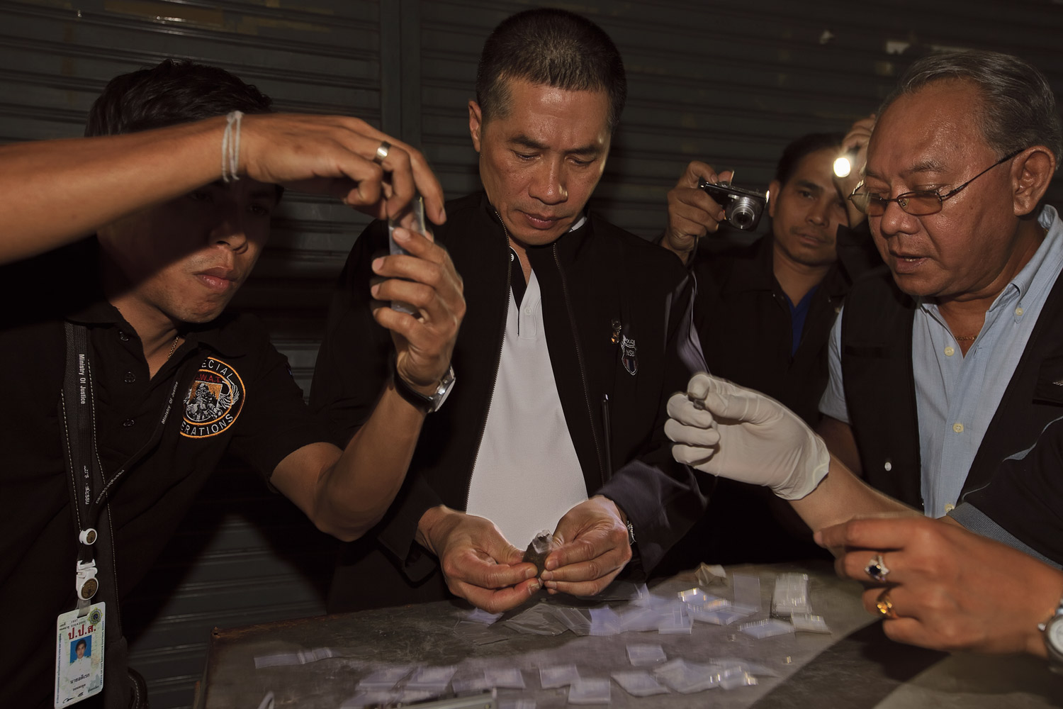 Police with Thailand’s Narcotics Suppression Bureau examine the haul after a drug bust in Bangkok.