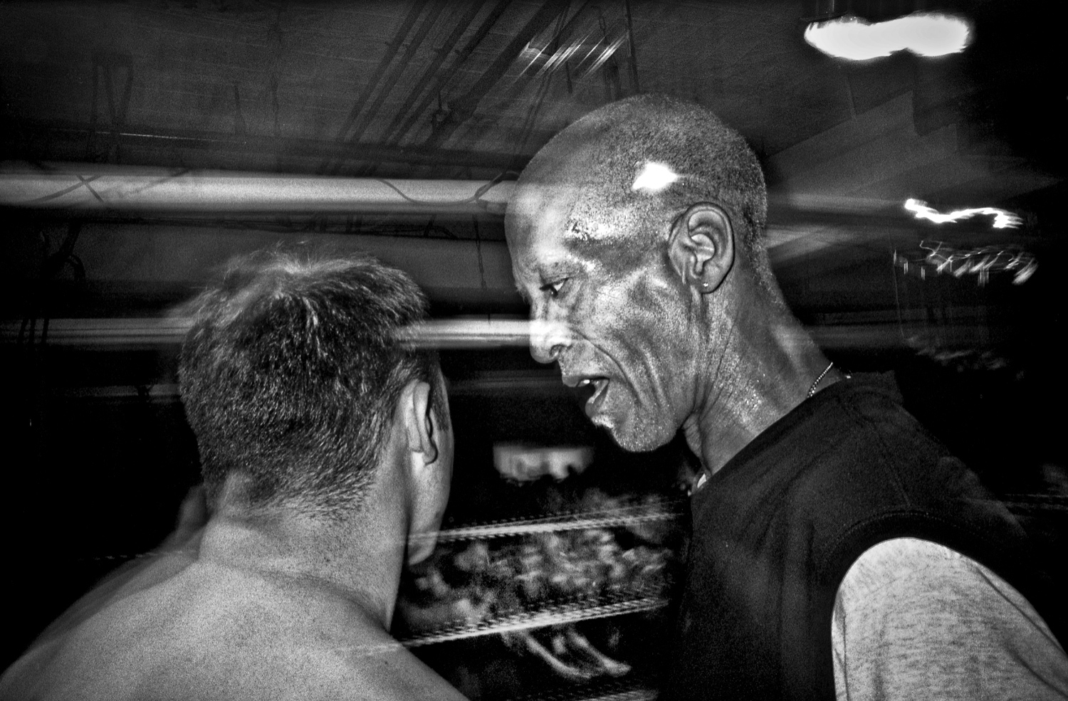 The referee speaks to one of the boxers.