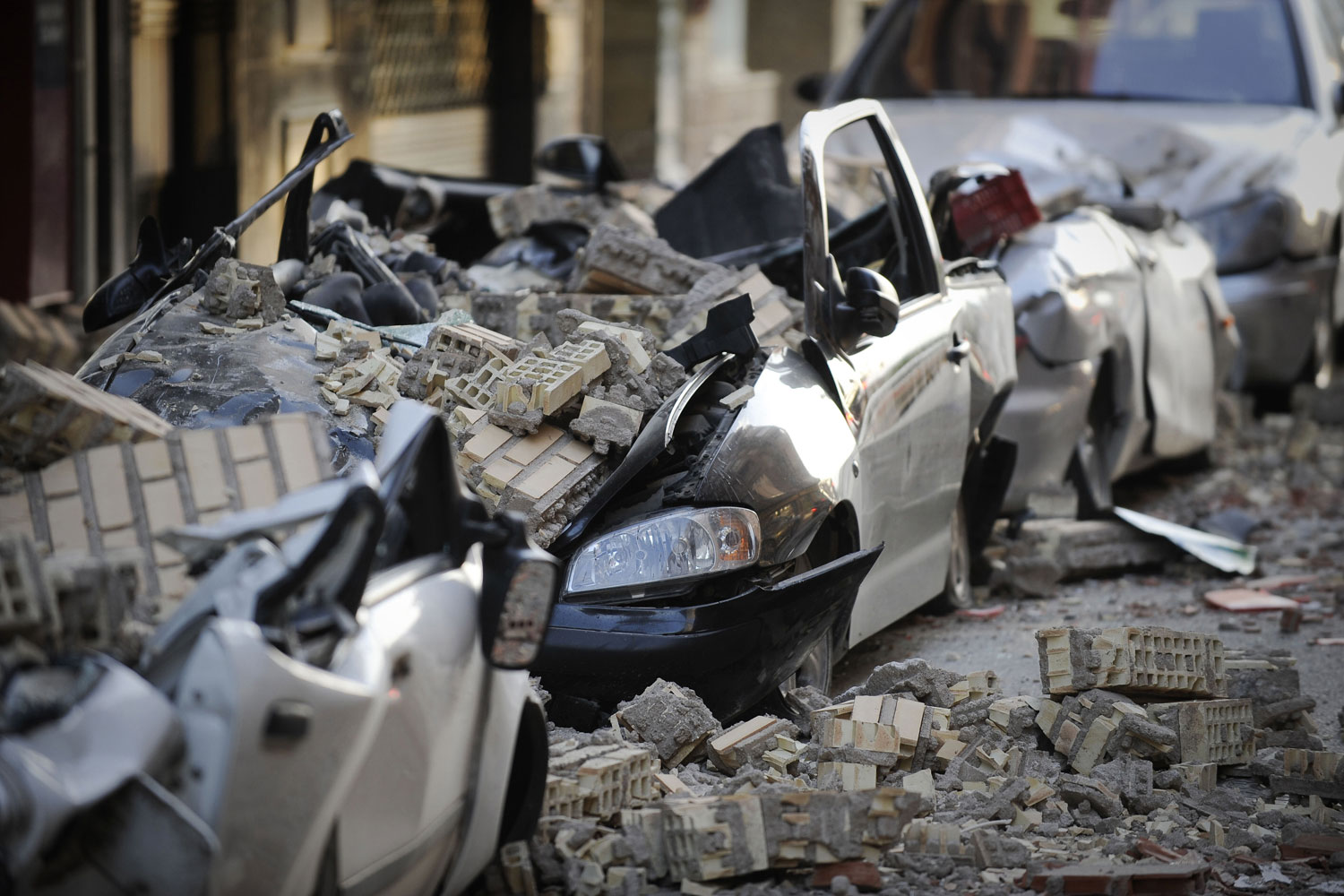 May 12, 2011. Cars crashed by debris in Lorca, southern Spain after a magnitude 5.1 quake killed at least 8 people, toppling buildings into the streets and sending panicked residents fleeing. Thousands of terrified Lorca residents spent a night shivering in parking lots, public squares and playgrounds fearing aftershocks from a quake of an intensity they never expected.
