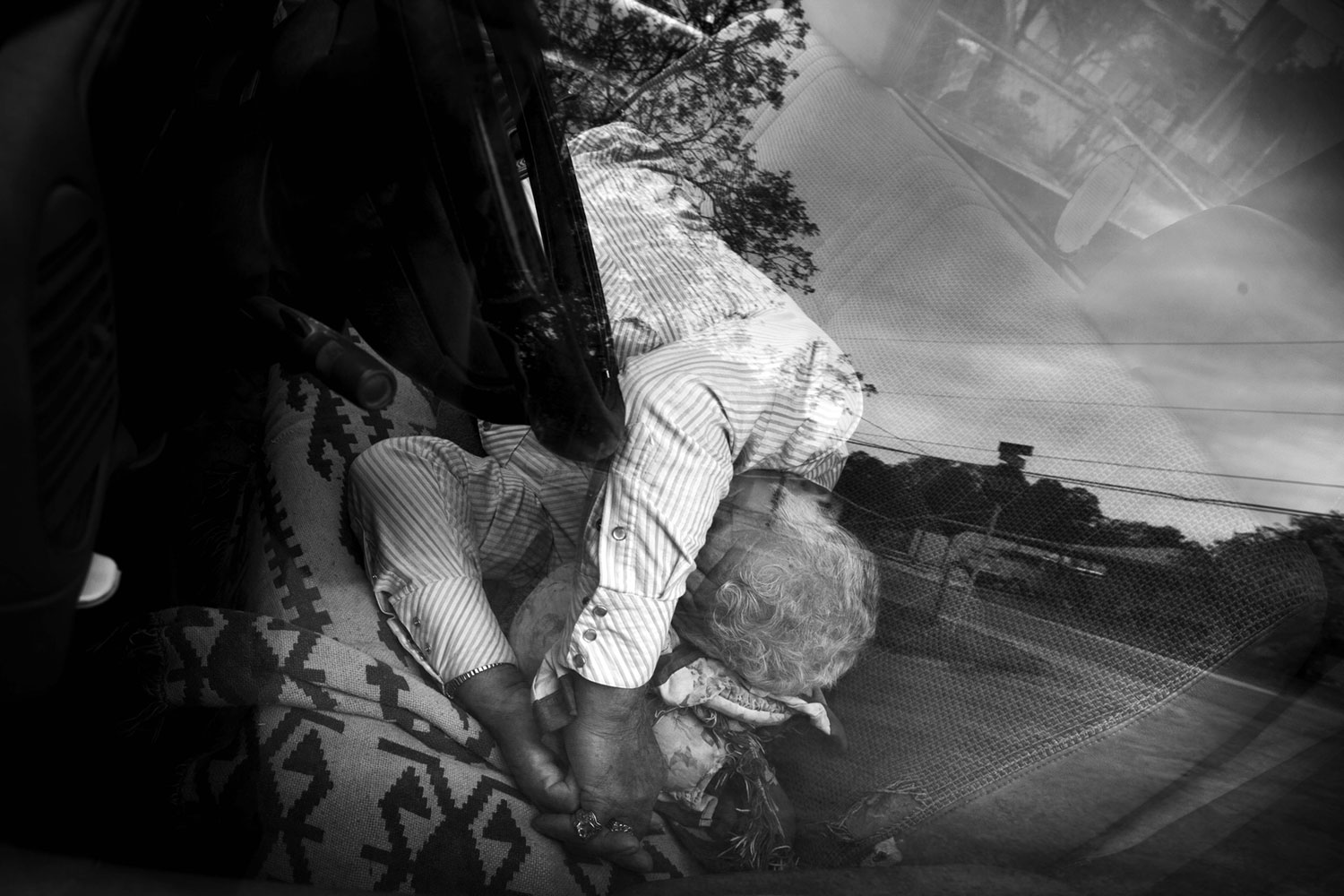 A man sleeps in his car in the San Felipe neighborhood, a Mexican area that runs along the US Mexican border in Del Rio, Texas. 2011