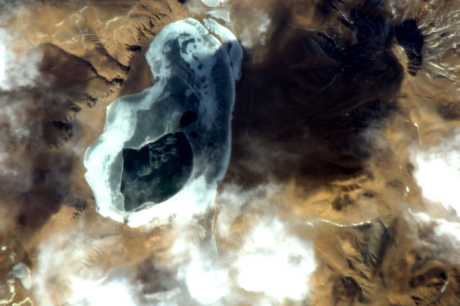 View of partially frozen lake on China's Tibetan plateau, Feb 11, 2011