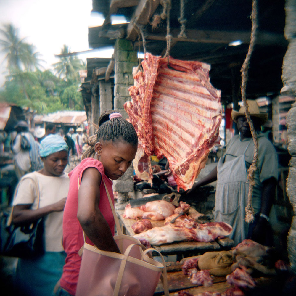A woman shopping at market in Camp Perrin.