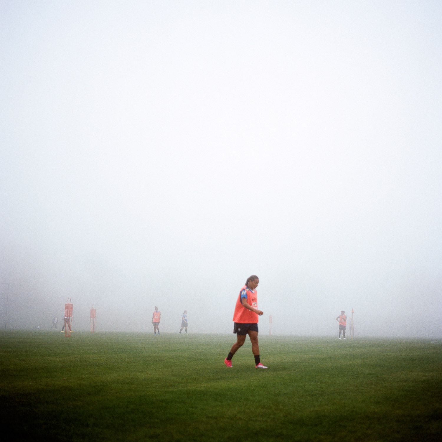 A Brazilian Women’s National team player walks between drills on a foggy afternoon training session at the Granja Comary in Teresópolis, Brazil. (October 25, 2010)