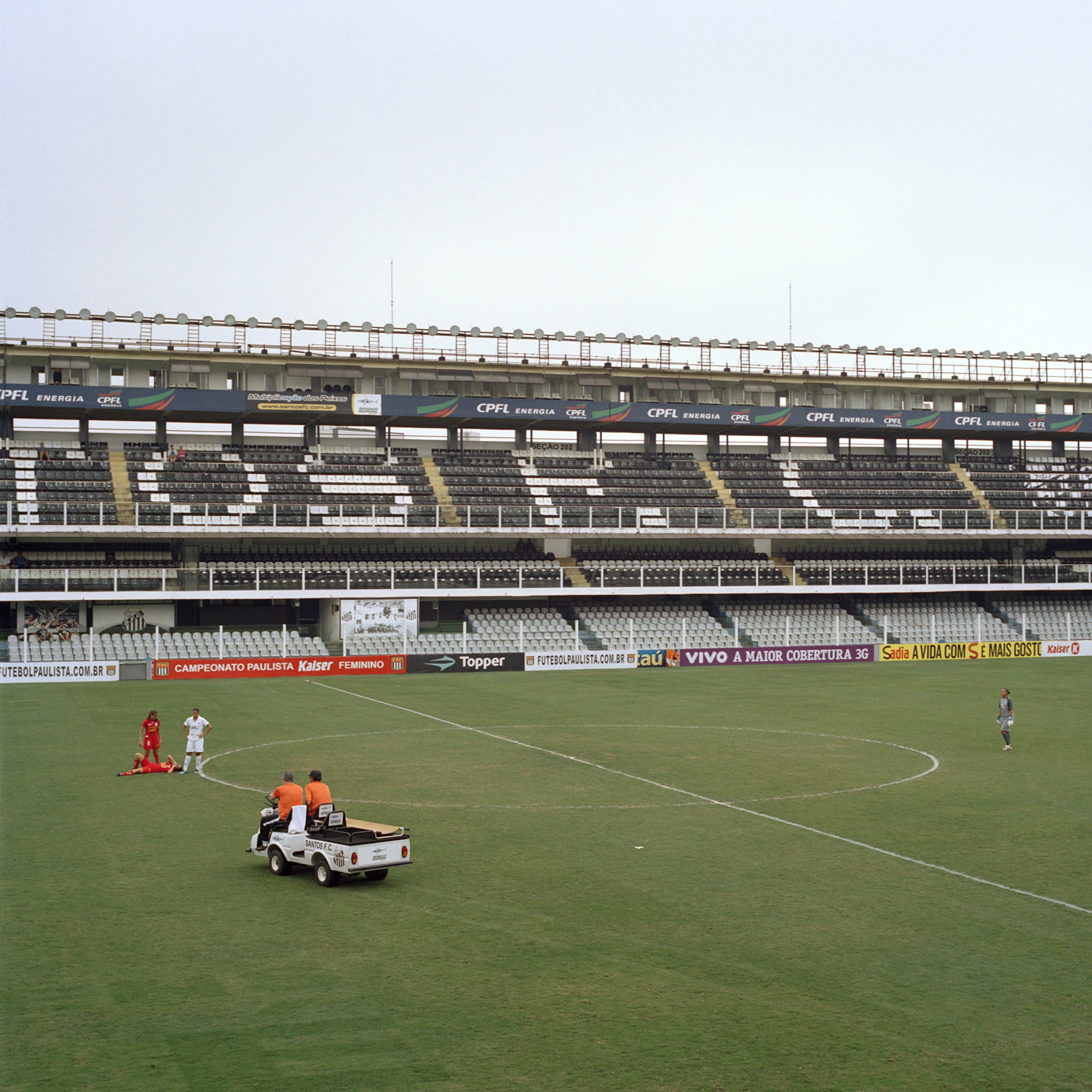 An injured Rio Preto EC player awaits medical assistance during a semi-final match versus Santos FC in the Copa Libertadores national tournament played in Santos' Estádio Vila Belmiro in Santos, Brazil. The women’s team, nicknamed the Serias da Vila (Vila’s Mermaids), are only granted use of the stadium’s field for final/semi-final matches and if the men are not scheduled to play. (October 23, 2010)