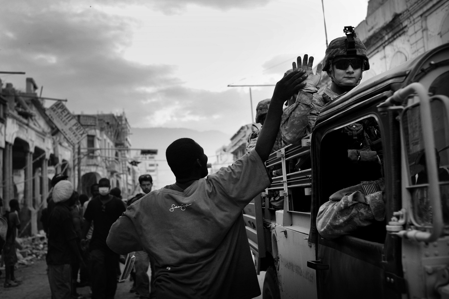 US Marines are greeted by Haitians in Port-au-Prince one week after the quake.