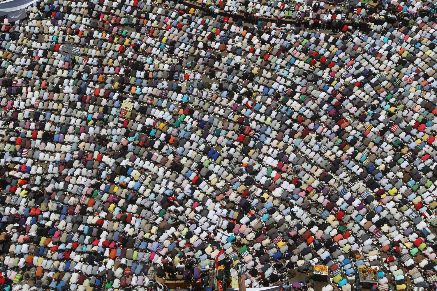 July 8, 2011. Egyptian demonstrators perform the weekly Friday prayer before a rally in downtown Cairo's Tahrir Square. Tens of thousands of Egyptians took to the streets across the country to defend the uprising that toppled president Hosni Mubarak, directing their anger at the new military rulers over the slow pace of reform.