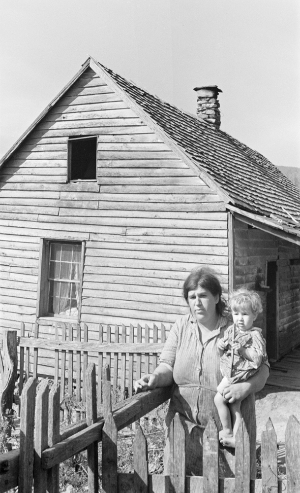 A mother and child in front of their home on Old Rag Mountain, Shenandoah National Park , October 1935