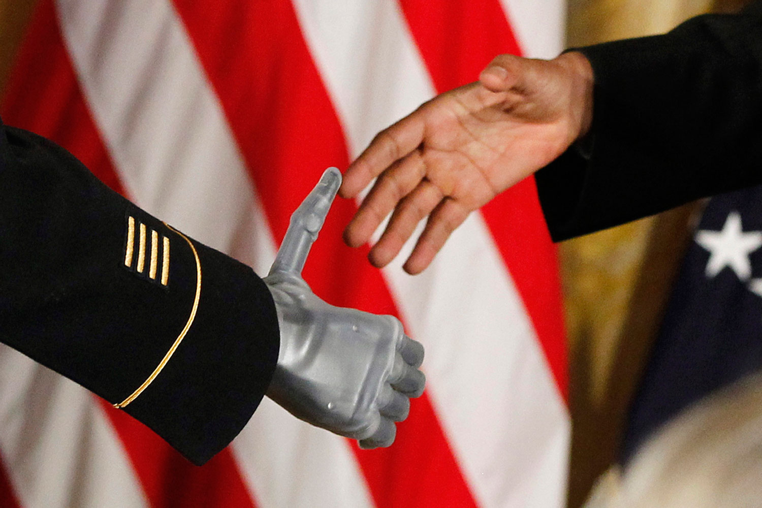 July 12, 2011. President Barack Obama shakes the prosthetic hand of U.S. Army Sgt. First Class Leroy Arthur Petry of Santa Fe, N.M., who received the Medal of Honor for his valor in Afghanistan in a ceremony in the East Room of the White House in Washington. Petry lost his right hand as he tossed aside a live grenade during a 2008 firefight in Afghanistan, sparing the lives of his fellow Army Rangers.
