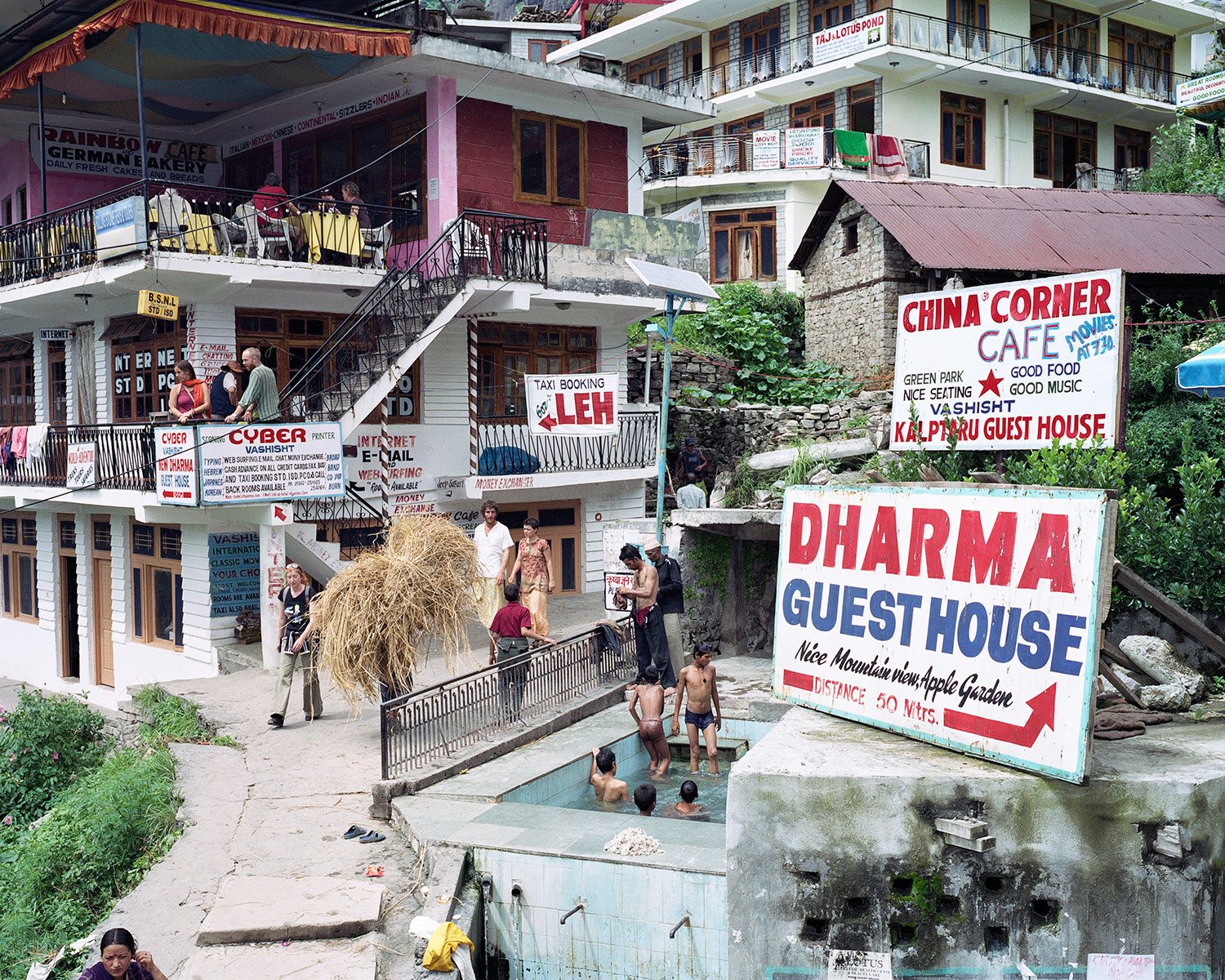 Hostels, an internet cafe and a hot spring beckon visitors in Vashisht, India, August 2007.