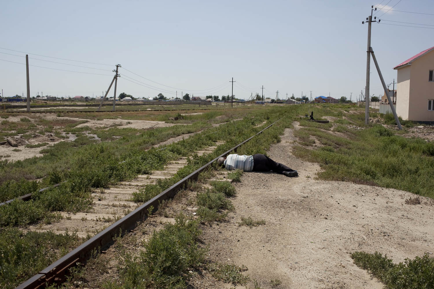 A man passed out on the train tracks near an oil refinery in Atyrau.