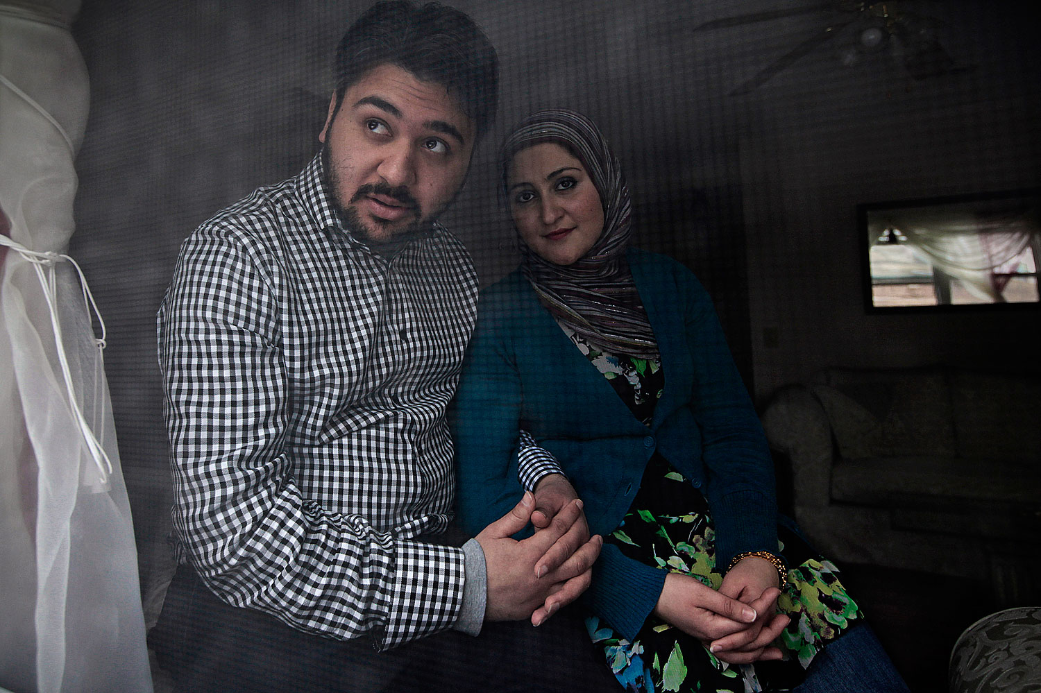 Ahmad Safi and his wife Deeba spend time together at their home in St. Joseph, Mo., March 6, 2010. The couple has been working with other Muslim families to establish the first Mosque in St. Joseph and say they have faced significant resistance from the local non-Muslim community members.