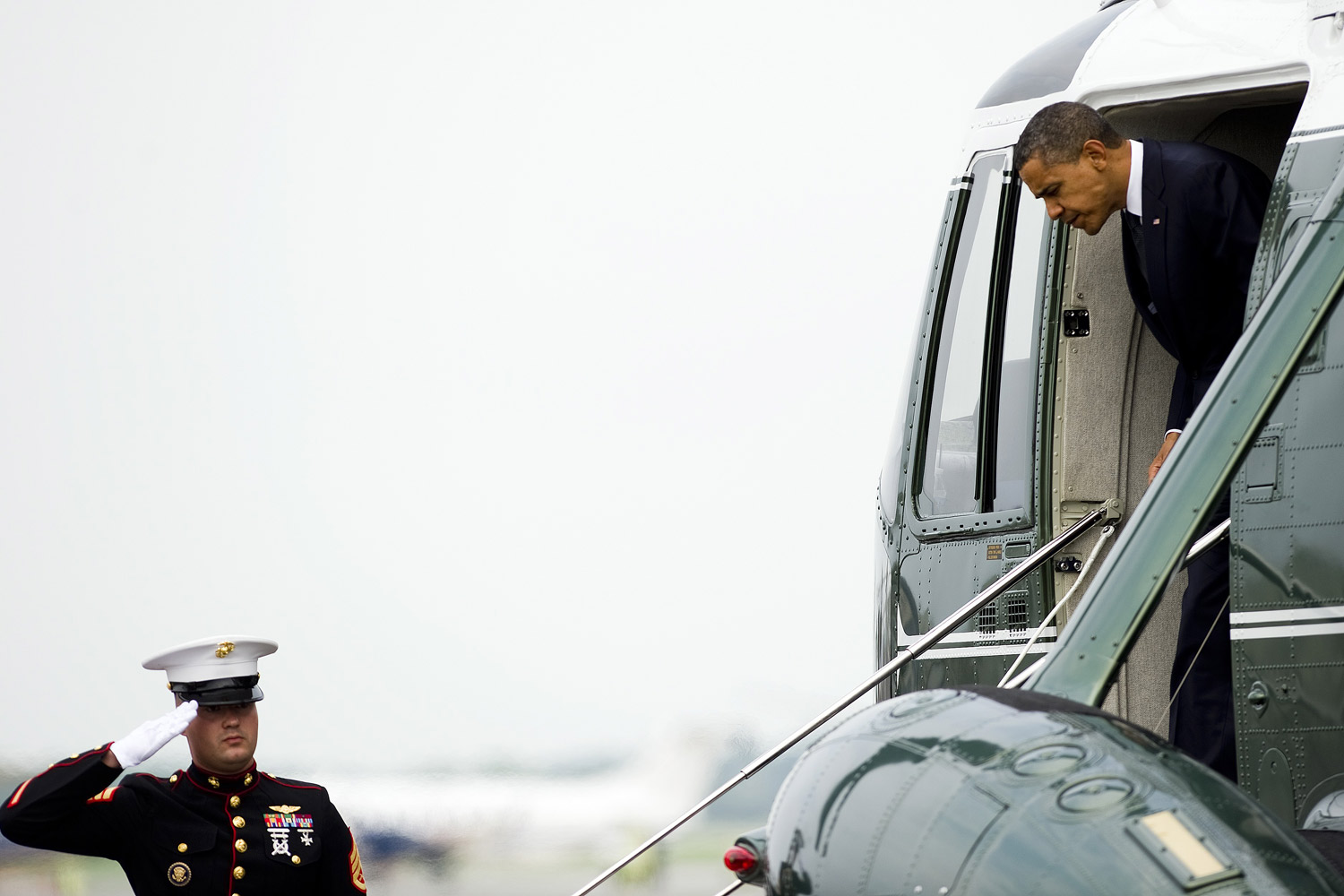 August 9, 2011. US President Barack Obama is saluted as he arrives at Dover Air Force Base where he will privately meet with families of the 30 Americans that died in a helicopter crash in Afghanistan.