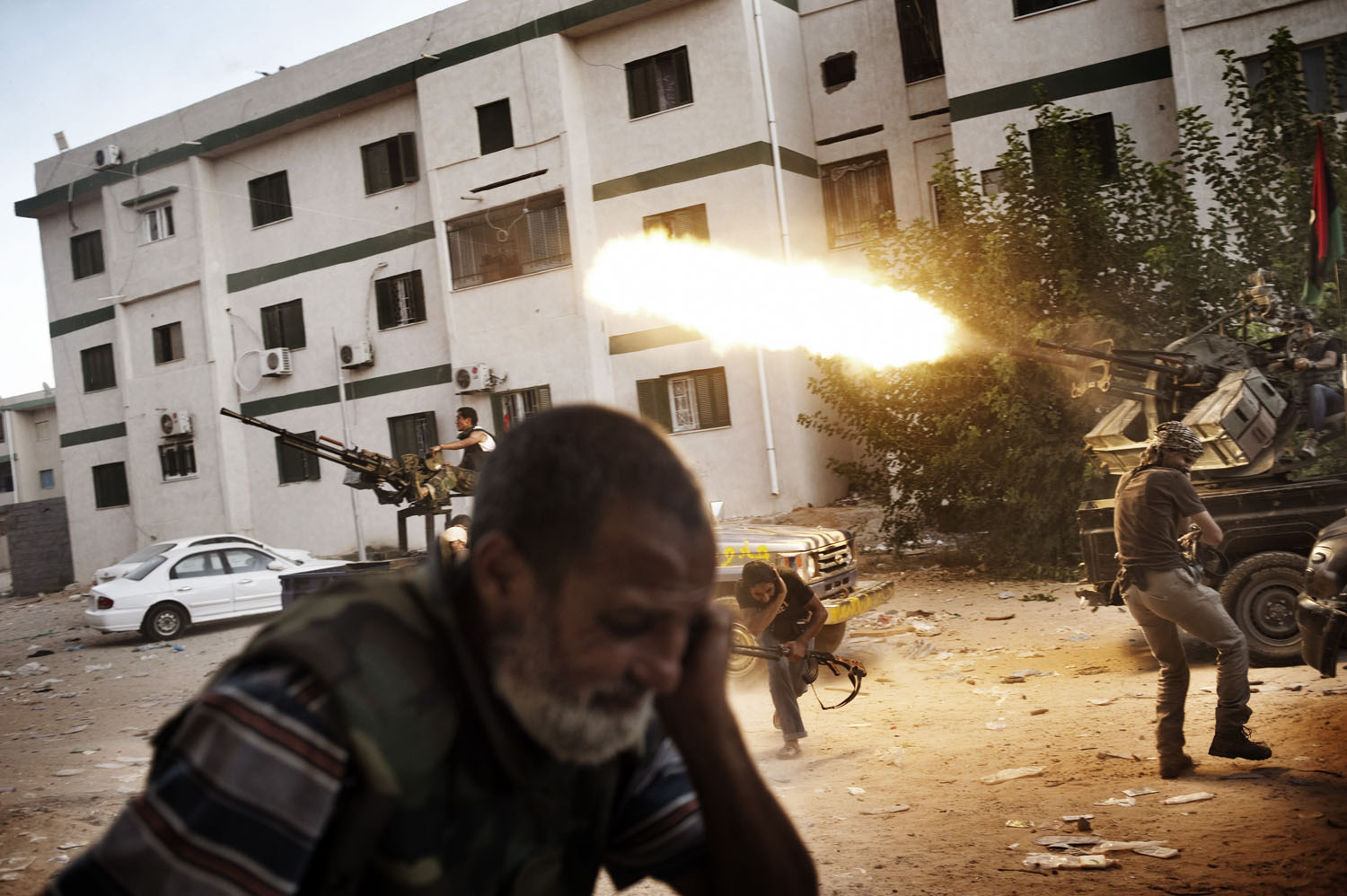 Libyan rebels clash with Gaddafi loyalists in Tripoli's Abu Slim neighborhood, August 25, 2011.