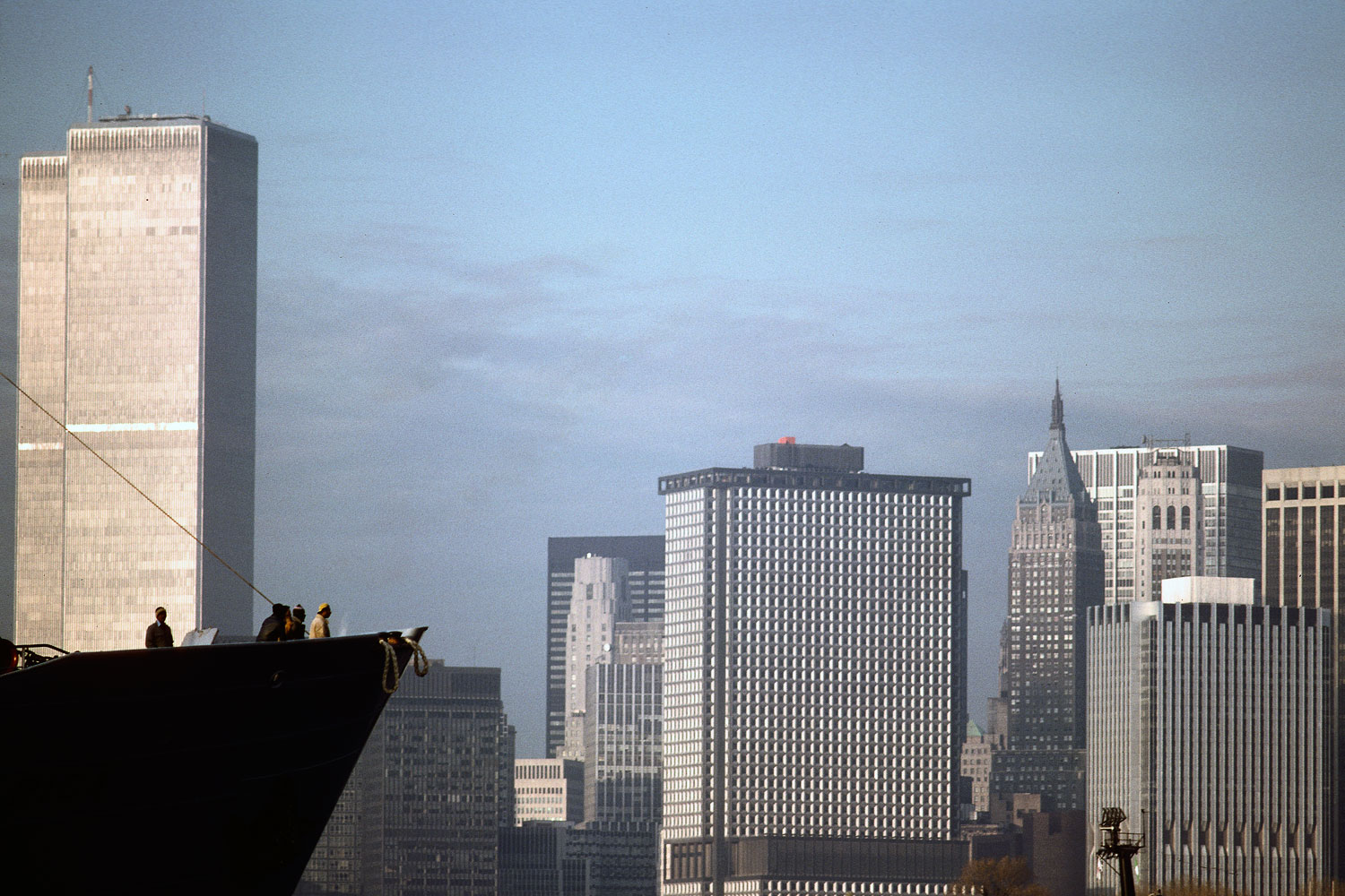 View of a passing banana boat and the Twin Towers from Red Hook, Brooklyn, 1978.
