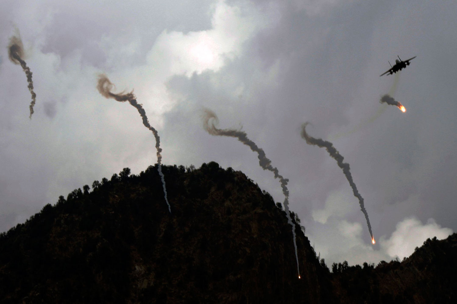 August 28, 2011. A U.S. F-15 fighter fires flares after striking Taliban insurgents in Kunar province in Afghanistan. After Taliban forces shot down a helicopter, killing 30 American soldiers, August became the deadliest month for U.S. forces since the war in Afghanistan began a decade ago.