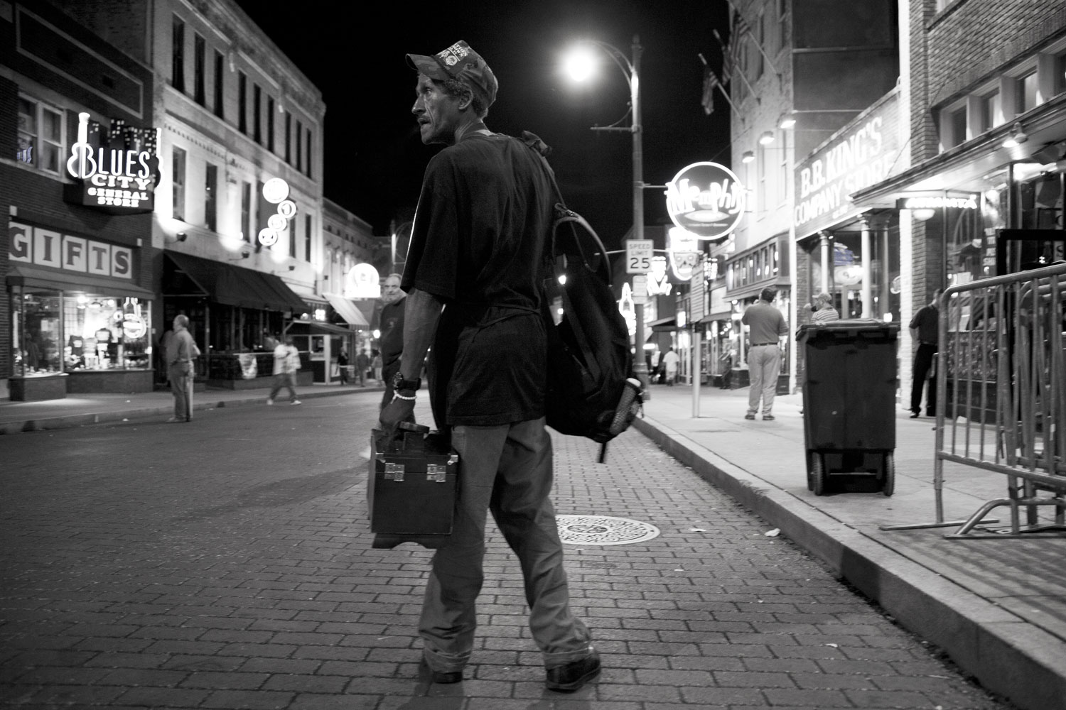 Shoe shine man looking for business along Beale Street in Memphis, Tenn.
