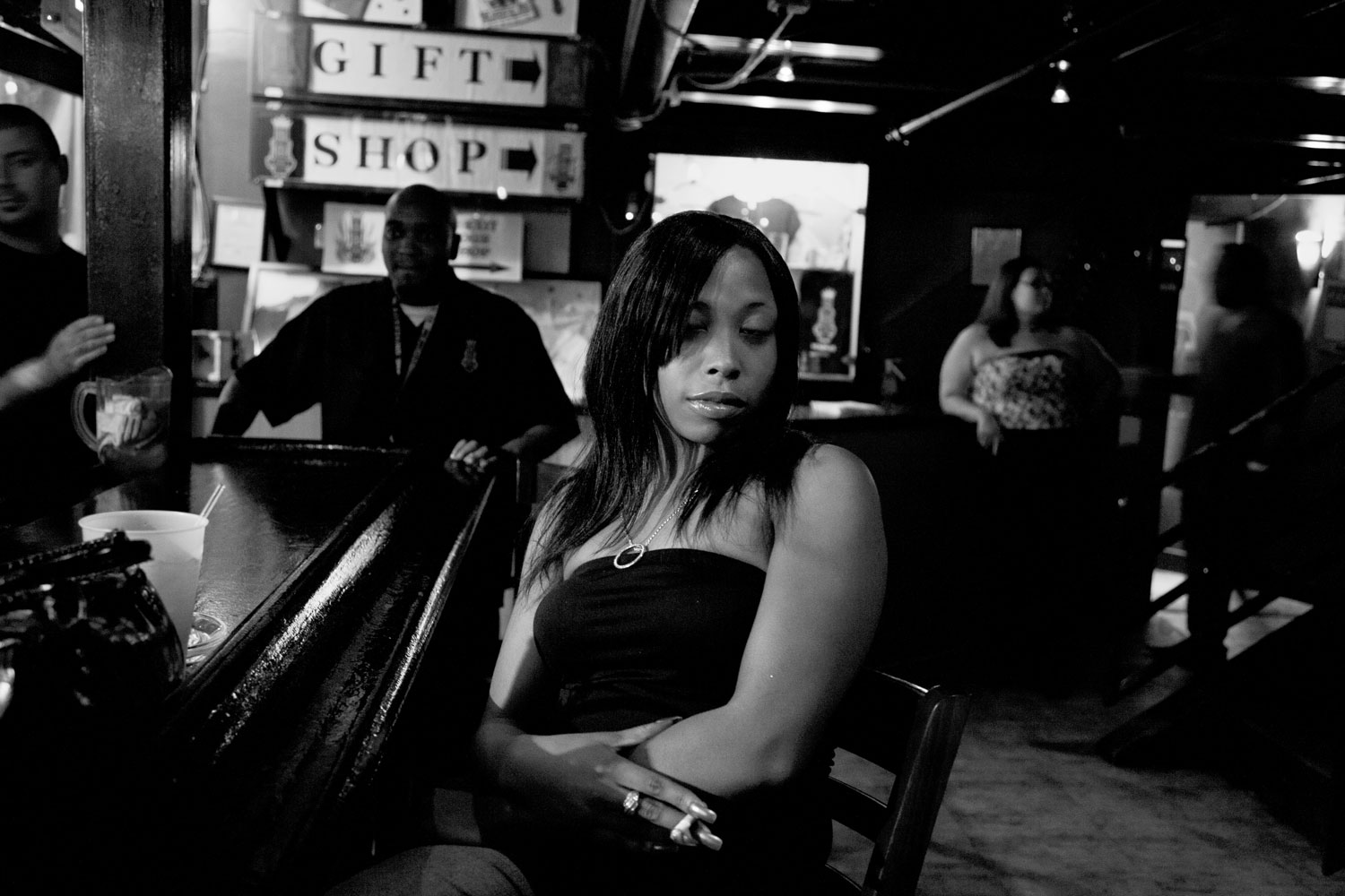 A girl enjoys a smoke in the bar at the B.B. King Blues Club in Memphis, Tenn.
