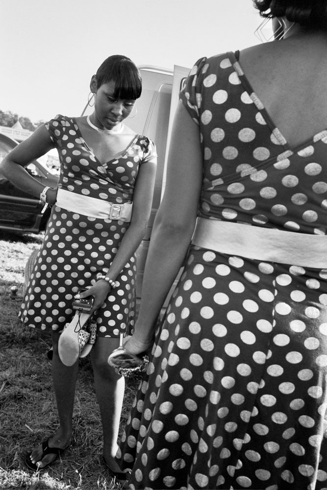Singers in polka dot dresses attend the Greenville Blues Festival,  the second oldest continuously operating blues festival in the United States held in Greenville, Miss.