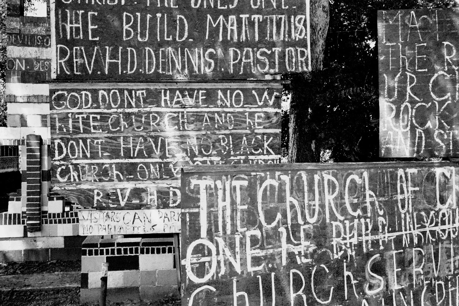 The Church of Christ and hand painted signs, in Vicksburg, Miss.