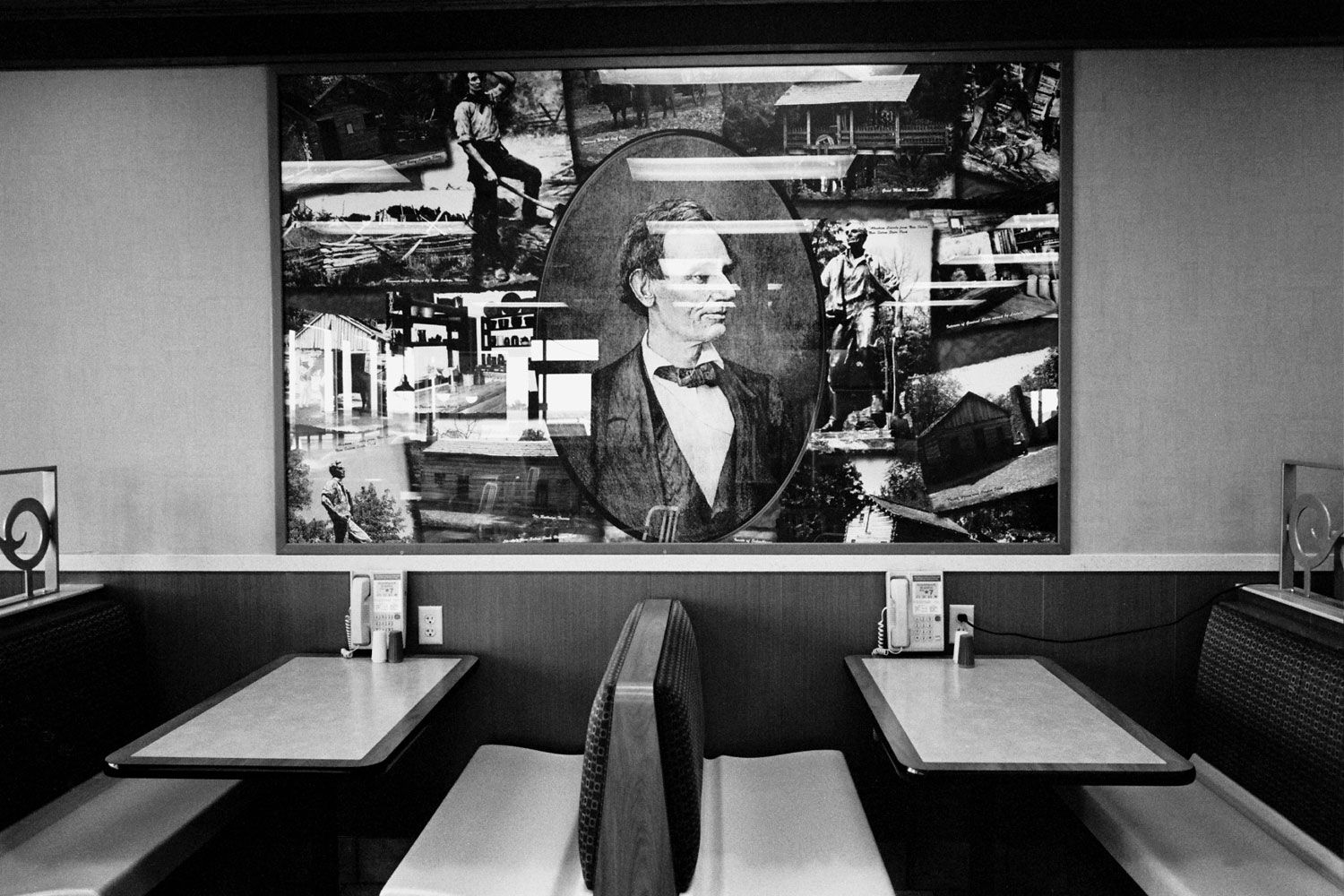 Abe Lincoln graces the walls above a booth at a roadside diner in Illinois.