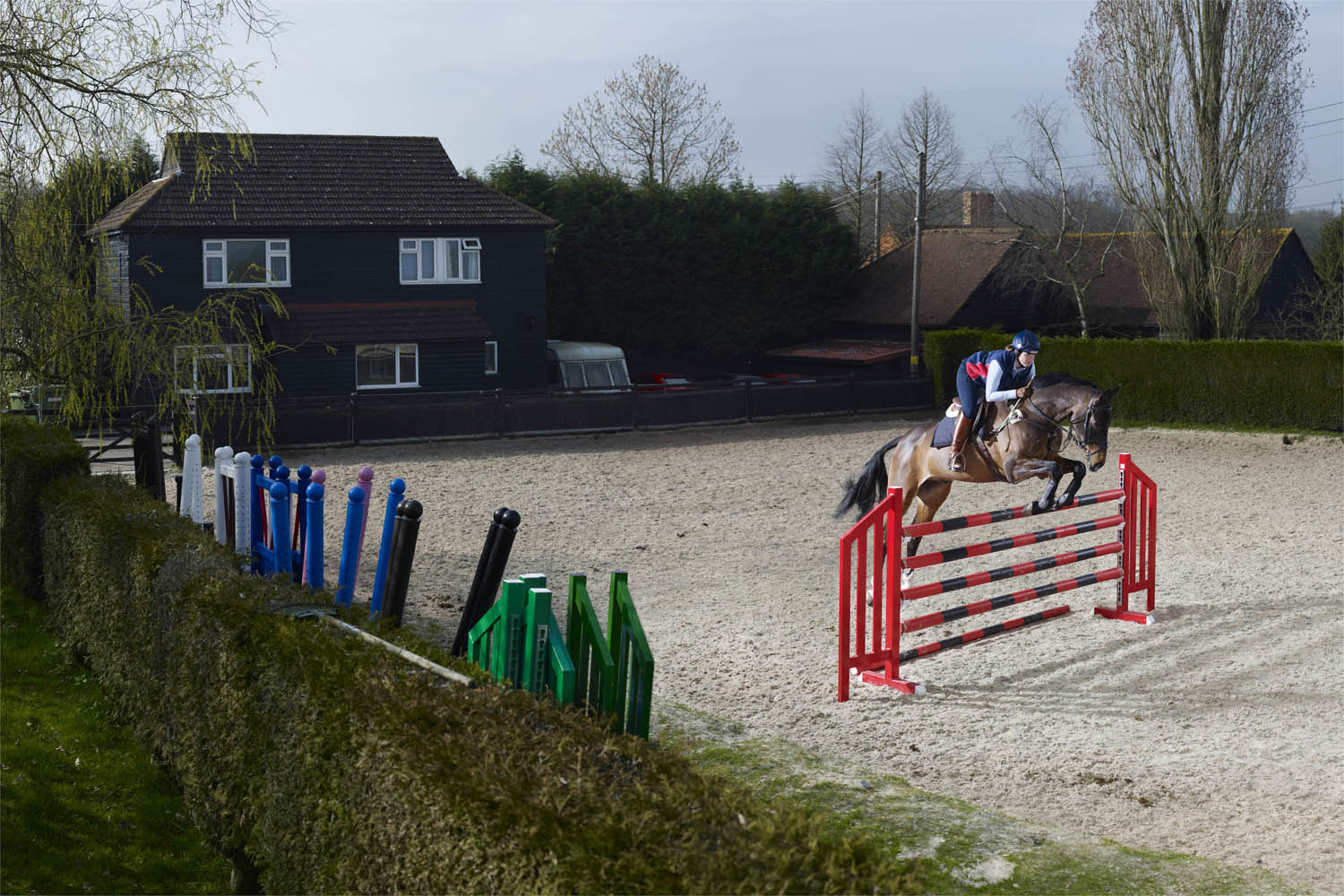 Pippa Funnell, three-day event rider, practices in the ring adjacent to her house.