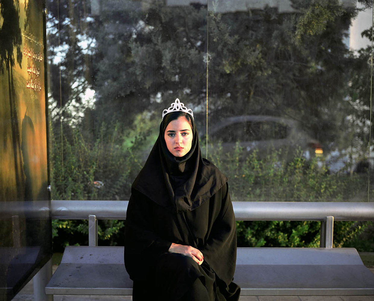 Newsha Tavakolian's photography focuses on women's issues in the Middle East. Recently she began a project making portraits of female Iranian singers who are not allowed to sing solo. Based upon their stories Tavakolian created photographs in December 2010, which act as their dream CD covers, including album titles. However, the cases are empty.