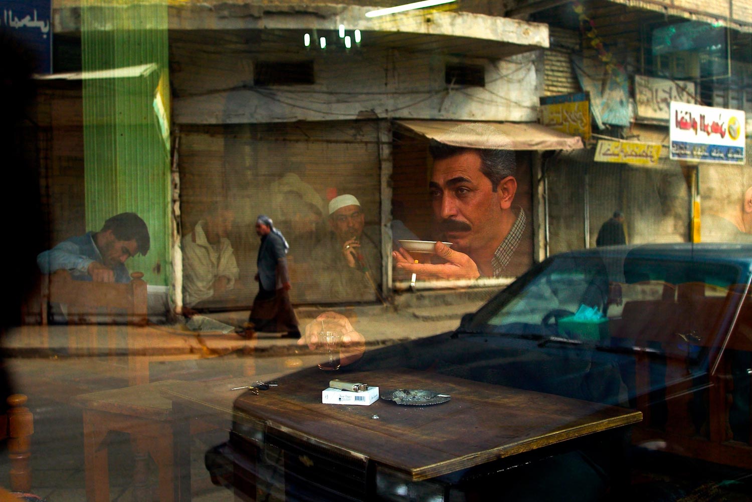 The window of the Al Zahawi cafe on Rashid street in Baghdad, Iraq, February 12, 2003. The cafe was named after a famous local poet and musician.