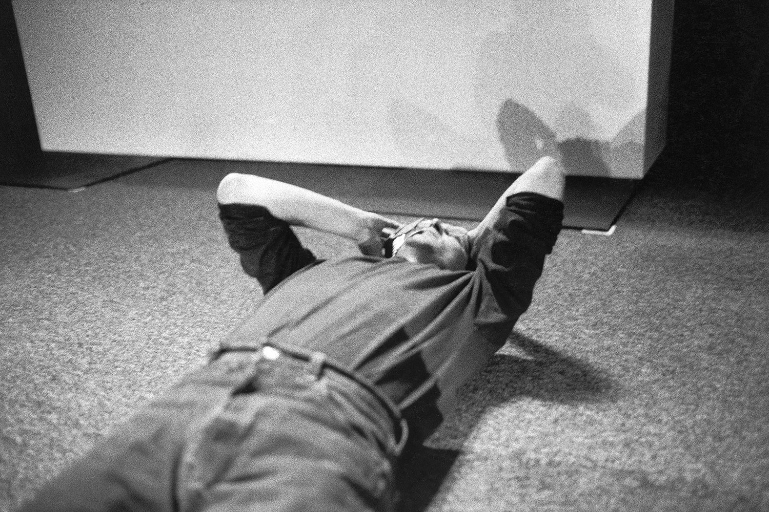 Lying on the floor after a long day, Jobs finalizes a deal with Bill Gates over the phone, whereby Microsoft would purchase $150 million worth of Apple stock.