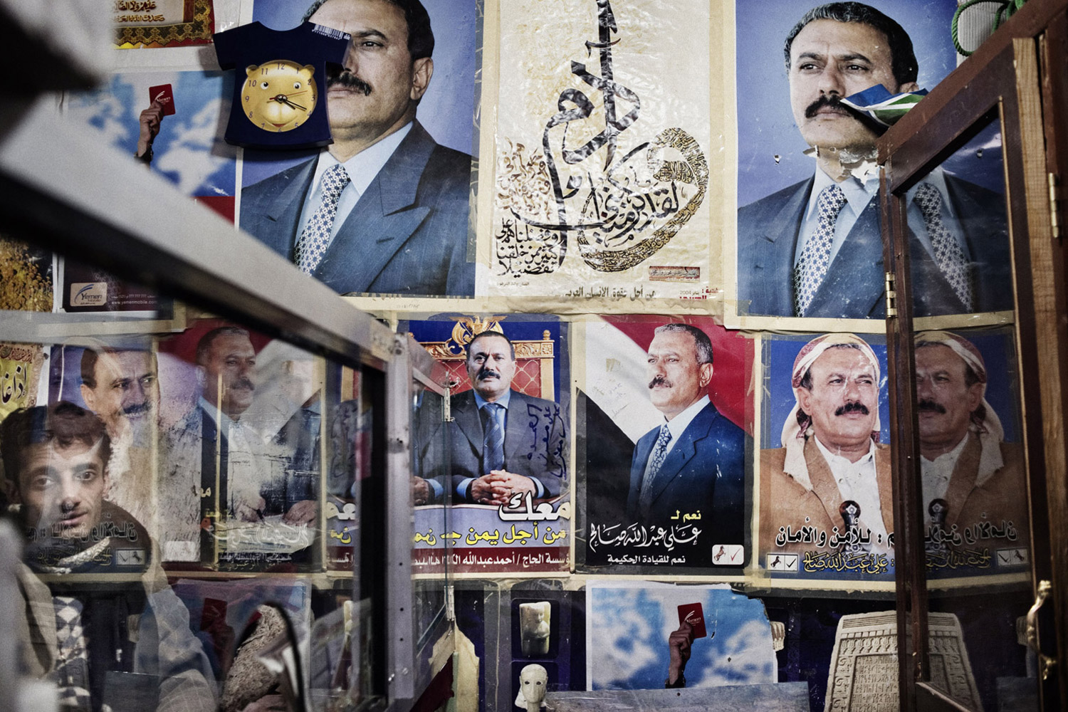 Yuri Kozyrev. From  Yemen: The Most Dangerous Domino.  March 14, 2011 issue.
                              
                              Pictures of President Saleh hang in a shop in the old town of Sana'a.