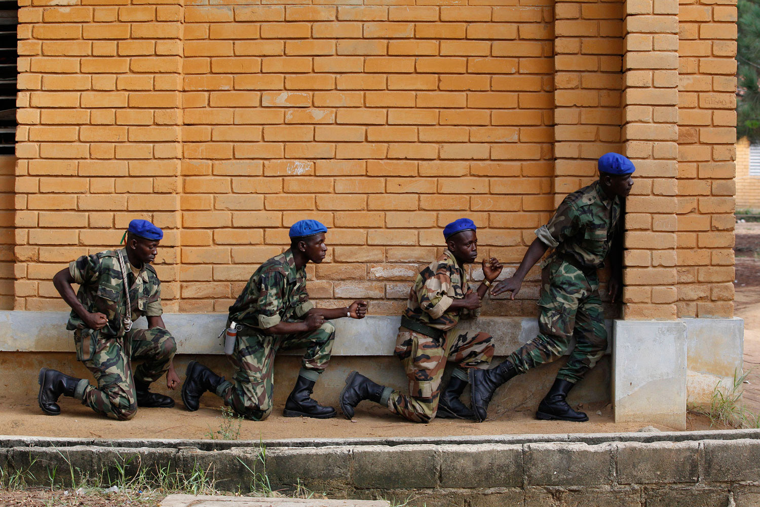 Soldiers from the Invisible Commandos, loyal to Ibrahim Coulibaly, practice ambush techniques without weapons in Abidjan, Ivory Coast, on April 19, 2011.