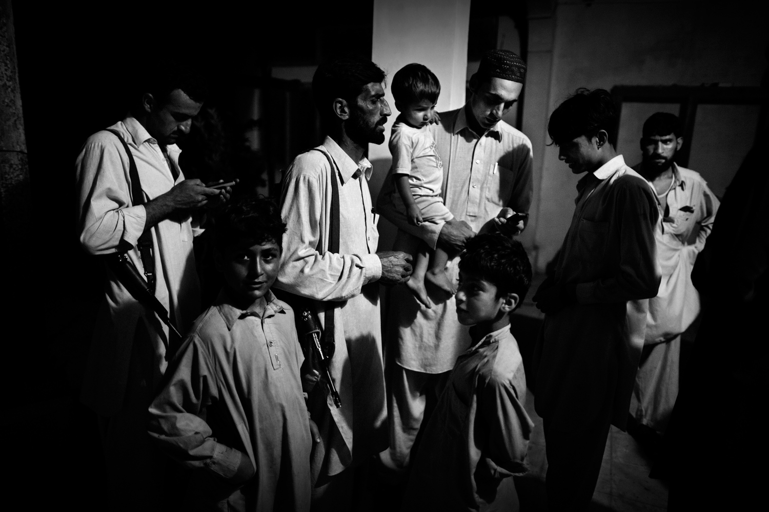 Pakistan, Swat Valley, Thal, November 2010. Lashkar members before leaving for pehra, the night patrol around the streets of their village. The operation goes on till 5 a.m., and can involve, as in this case, even the youngest members.