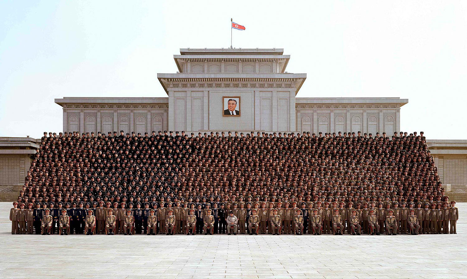 This undated photo, released by North Korea's official Korean Central News Agency (KCNA) on Mar. 20, 2009, shows Kim Jong Il (front row, center) posing at a meeting of active outpost soldiers at the plaza of the Kumsusan Memorial Palace in Pyongyang.