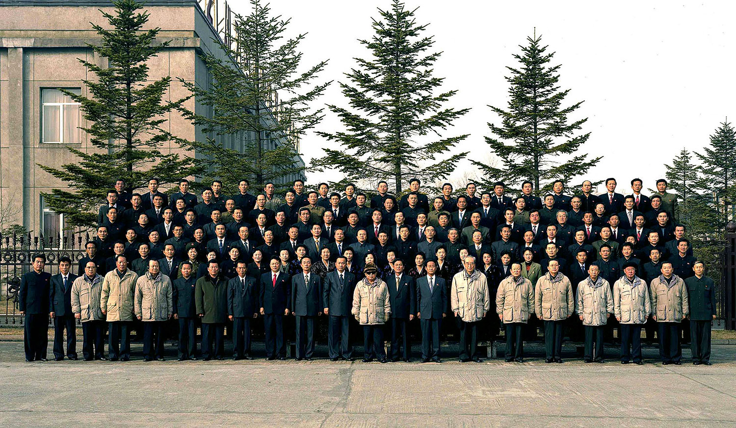 This undated photo, released by KCNA on Dec. 7, 2010, shows Kim Jong Il (center, in sunglasses) posing with employees during his visit to the Kim Chaek Iron and Steel Complex in North Hamgyong Province.