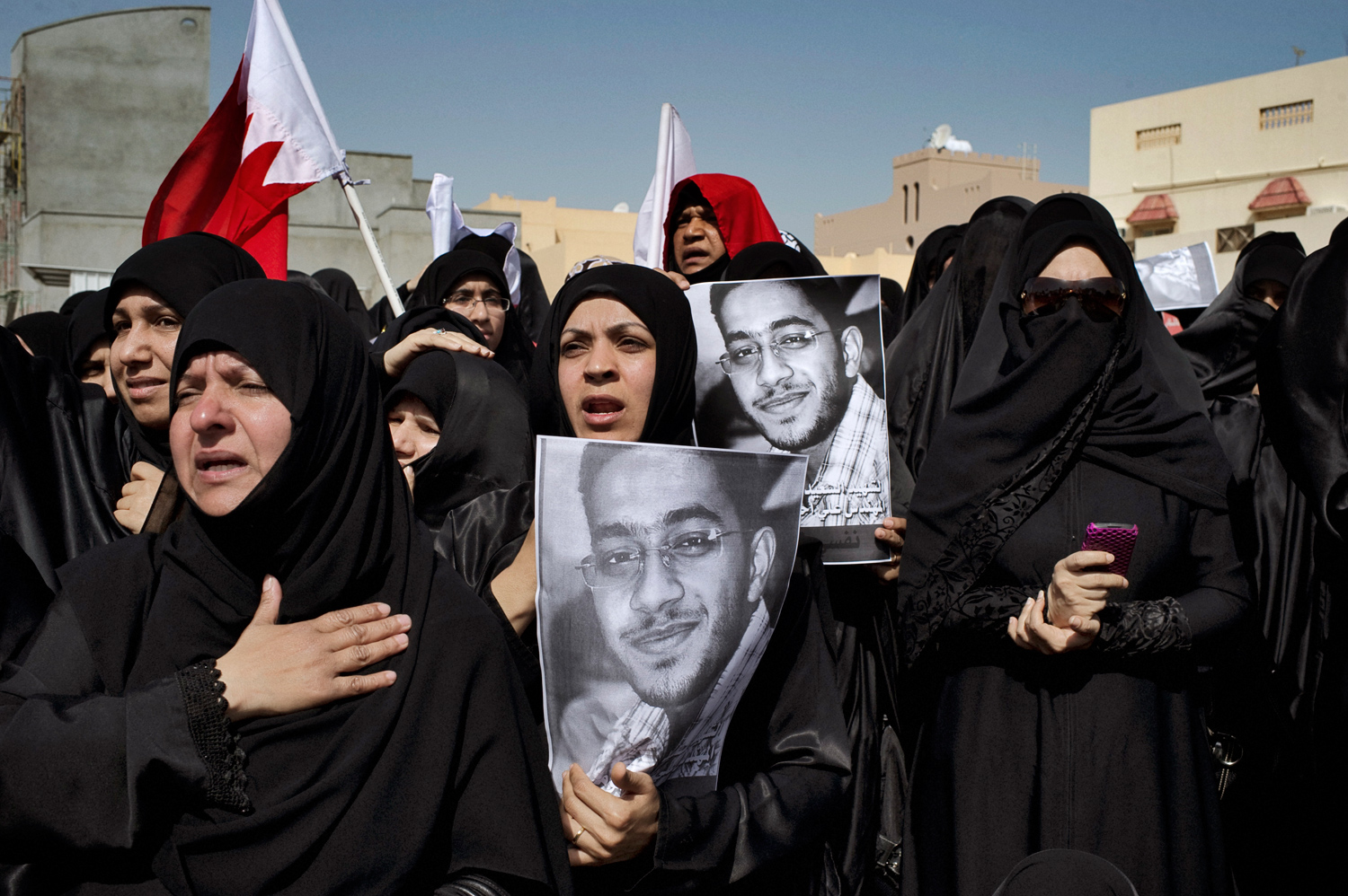 Manama, Bahrain —February 18, 2011
                              Several thousand Shi'ites turn out to bury three of those killed in police raids.