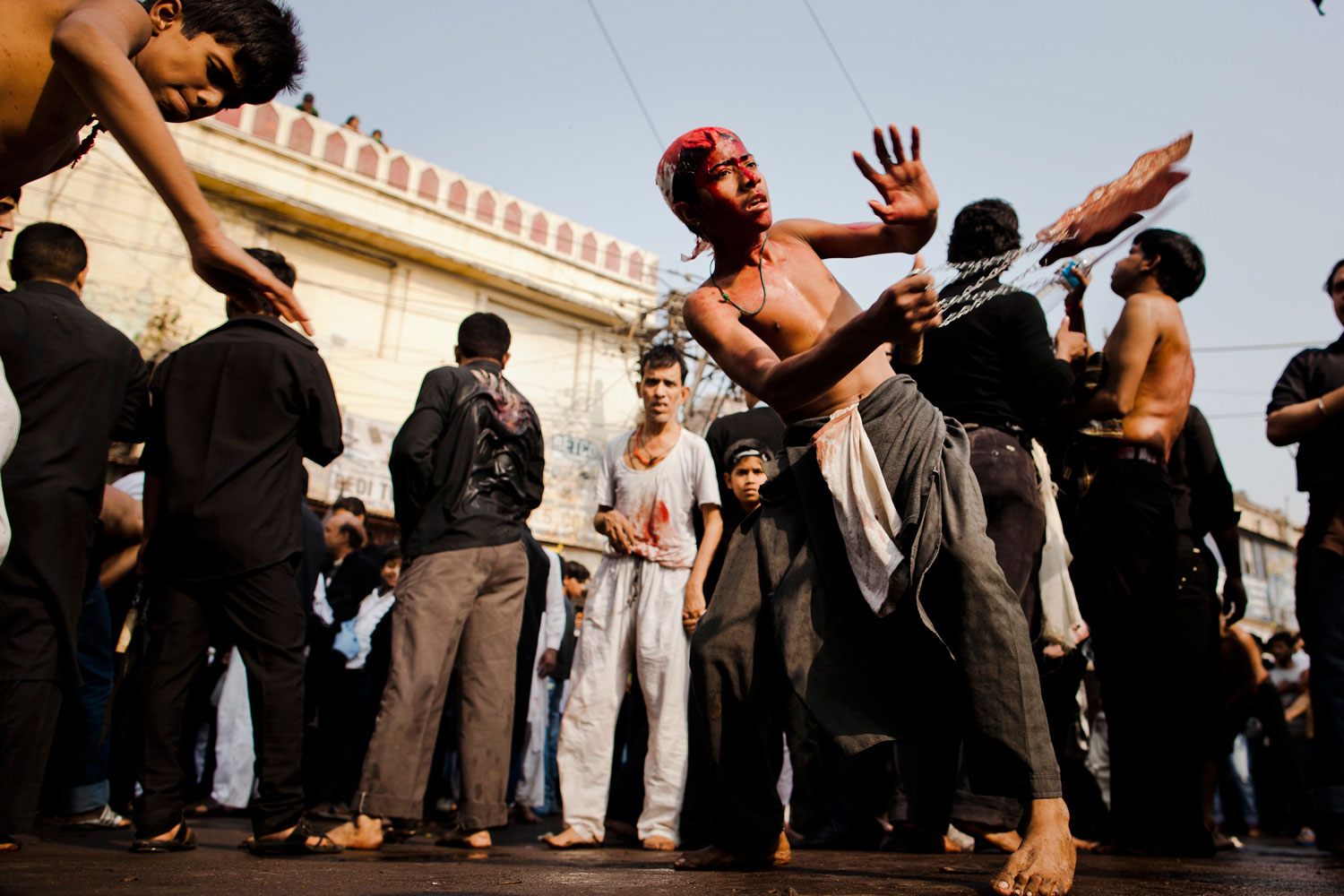 December 6, 2011. Shi'ite Muslim boys beat their chests as they practice self-flagellation during the religious ritual of Ashura in New Delhi, India.