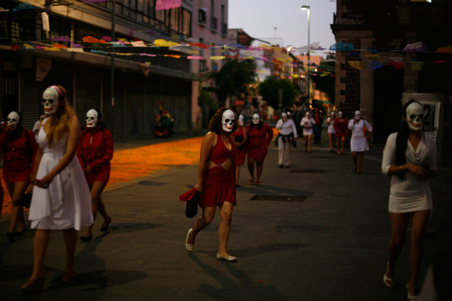 October 29, 2011. Sex workers wearing skeleton masks, which represent the Day of the Dead, participate in a procession in Mexico City.