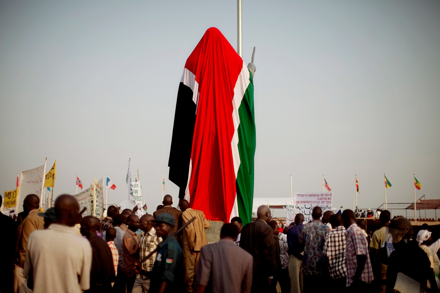 July 9, 2011. A newly constructed statue commemorating the late Dr. John Garang, the leader of the Sudan People's Liberation Army is covered by the new flag in the capital city of Juba. The statue was constructed ahead of southern Sudan's declaration of independence and later unveiled by South Sudan's President, Salve Kiir.