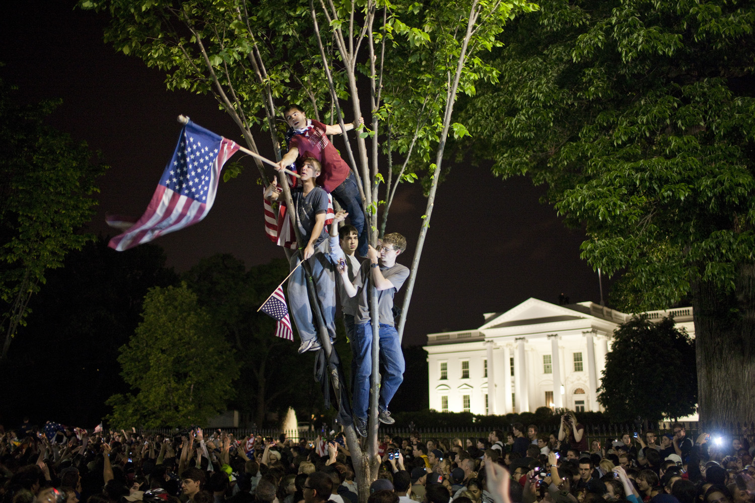 Brooks Kraft. From  Death Comes for the Terrorist.  May 20, 2011 issue.Crowds celebrate on Pennsylvania Avenue in front of the White House in Washington, after President Barack Obama announced that Al-Qaeda's leader Osama bin Laden had been killed.