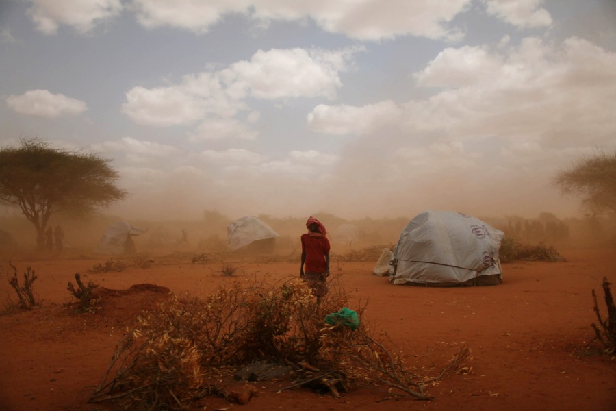 Jehad Nga. From  Haven and Hell.  August 8, 2011 issue.
                              
                              A sandstorm blows through Ifo Camp where new arrivals live. 30,000 people are estimated to have arrived at the camp in June, a steep climb from the average of 5,000 last year. Dadaab, Eastern Kenya, July 18, 2011.