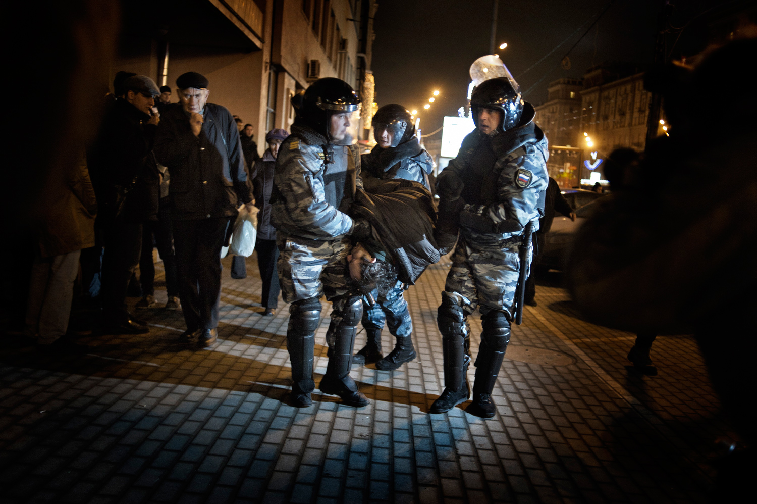 Moscow, Russia — December 6, 2011
                              Police detain a demonstrator during protests against alleged vote rigging in Russia's parliamentary elections in Triumphal Square.