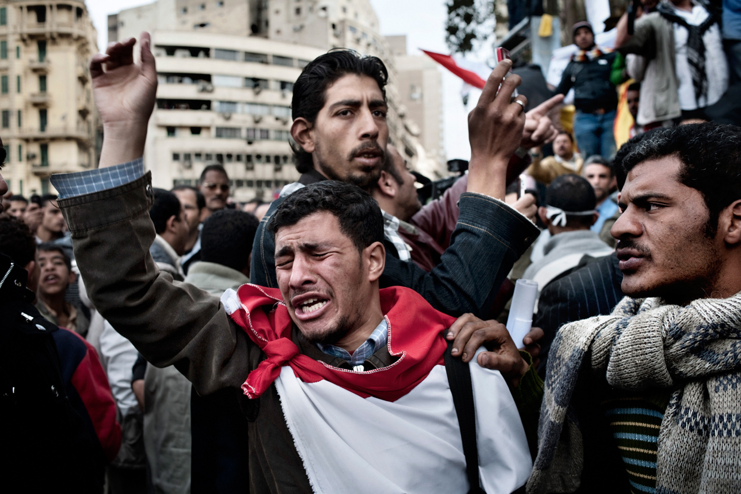 Cairo, Egypt — February 13, 2011
                              Protesters react after the army ordered their encampments to be torn down in Tahrir Square.
